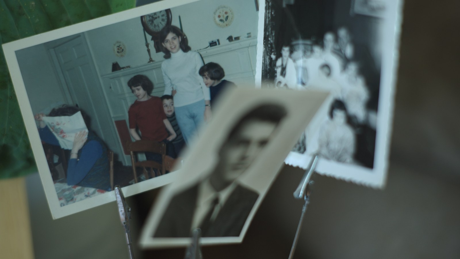 Family photographs gathered on a table
